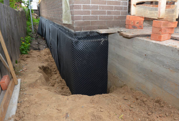 Happy homeowners after waterproofing job in Menasha